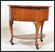 A 1930's Art Deco walnut dem lune sewing box - workbox. Raised on castors with cabriole legs
