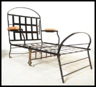 A 19th century VIctorian painted ebonised metal folding campain chair / armchair.  Strap metal