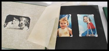 A collection of 4x vintage 1950's photograph albums, all with many candid images of a holiday / trip