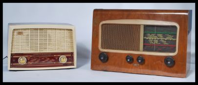 A vintage 20th Century walnut cased valve radio by Cossor together with a bakelite radio by