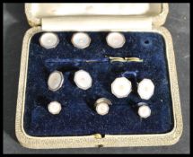 A cased set of vintage 20th Century dress cuff-links and studs, sterling silver and mounted with