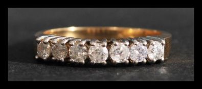 A hallmarked 18ct gold and diamond 7 stone ring. Diamonds approx 50pts. Hallmarked Sheffield. Weight