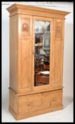 A Victorian pine single wardrobe having plinth bas