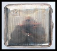 An early 20th century silver hallmarked cigarette case by William Hair Haseler; W H Haseler Ltd