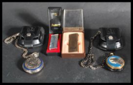 Two Franklin Mint Collectors pocket watches, with fob chains and leather belt pouches, each watch
