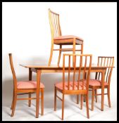 A 1960's retro 20th century Macintosh of Kirkcaldy teak dining suite comprising extending dining
