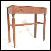 An early 20th Century oak marble topped washstand, single carved drawer to front raised on reeded