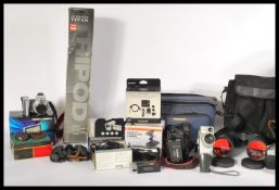 A collection of both vintage and new electronics and other items to include several cameras and