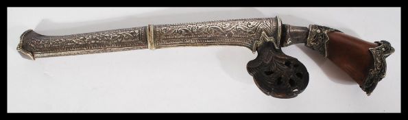 A 19th century silver and horn dagger in the form of a musket. Highly detailed with silver white