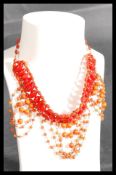A vintage early 20th century stone bead headdress having various strands of graduating bead