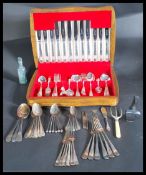 A mid 20th Century cased canteen of cutlery by Price Brothers together with a collection of loose