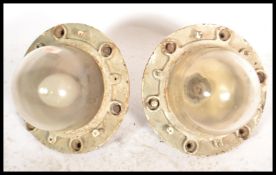 A pair of vintage retro 20th century space age style GEC industrial caged bulk head lights.