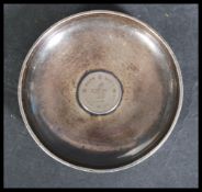 An early 20th century Chinese silver bowl pin dish with inset Hong Kong colonial coin. Chinese