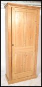 A Victorian large 19th century country pine housekeepers cupboard raised on a plinth base having a
