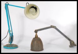 A vintage retro 20th century anglepoise desk lamp in blue raised on a circular base with pendant