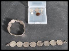 An early 20th Century silver bracelet bangle made from silver 3p coins together with another coin