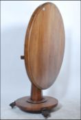 A 19th century Georgian mahogany tilt top dining t