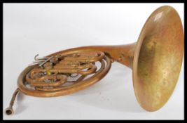 A vintage early 20th century copper and white metal French Horn of typical form. Please images.