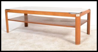 A retro 1970's teak wood coffee - occasional table by Myers having inset smoked glass table top