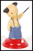A rare ' Sooty ' night light / children's bedside table lamp in plastic raised on a red terraced