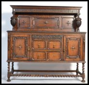 A 1920's large oak barleytwist sideboard. Raised o