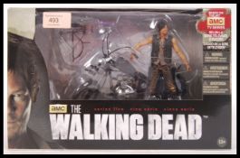 An original AMC ' The Walking Dead ' McFarlane Toys deluxe boxed set having a figure of the