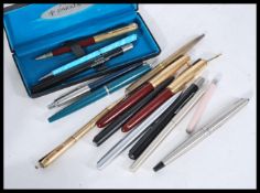 A collection of vintage 20th Century Parker fountain pens, Parker ball point pens, propelling