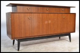A 1970's G-Plan Tola wood ' Librenza ' pattern sideboard with ebonised tapering legs, wide body with
