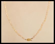 A baroque pearl necklace of graduating bead form having an 18ct gold clasp.
