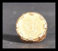 A 19th century Victorian gold sovereign in a 9ct gold ring mount. Dated for 1892. Total weight 16