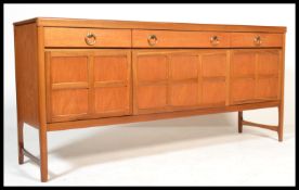 A mid century Nathan Furniture teak wood  credenza sideboard being  fitted with drawers and