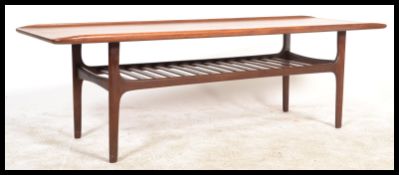 A 1970;s Danish influence teak wood Long John coffee occasional table of rectangular supports raised