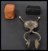 A 19th century brass skirt lifter, the scissor act