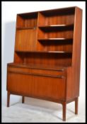 A 1970's McIntosh of Kirkcaldy teak wood upright sideboard room divider cabinet having a shaped