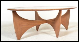 A G-Plan 20th century teak wood coffee table table having a shaped top being raised on a space age