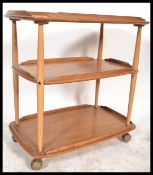 A retro 1970's vintage 20th century Ercol 3 tier butlers serving buffet trolley. Light beech and elm