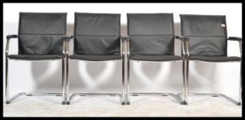 A set of 4 retro style  chrome cantilever dining chairs with original black leatherette back and