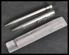 Two silver pusher pencils of larger form one being a sterling life long and the other of hexagonal