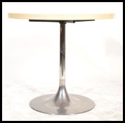 A retro mid century tulip dining table in the manner of Eeero Saarinen.  Polished steel tulip base