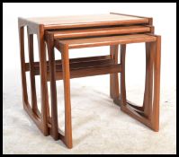 A G-Plan retro teak wood 1970's graduating nest of tables in the Quadrille pattern. The tables