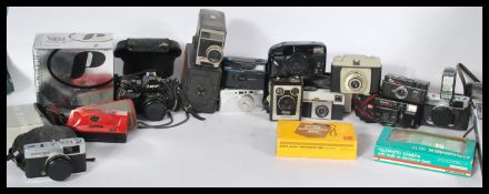 A collection of vintage 20th century cameras and photography equipment to include lenses , carry