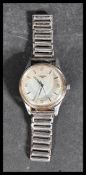 A vintage gents Longines automatic wristwatch with silvered face and baton numerals set to stainless