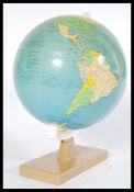 A vintage small 20th century desktop globe on plinth base by Rath entitled the political globe.