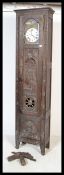 A 19th century French chestnut / oak large Breton compoise longcase clock having  oversized trunk