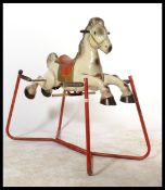 A vintage 1960's retro tin pressed metal MOBO rocking horse. Original labels with good colours