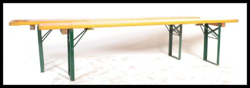 A pair of mid 20th Century Industrial factory work benches. Each of panelled wood with folding metal