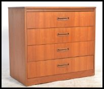 A danish inspired retro 20th Century teak chest of four straight drawers raised on a plinth base.