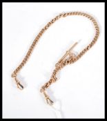 A 9ct gold hallmarked albert chain with twin lobster clasps and bar. Hallmarked to the bar, makers