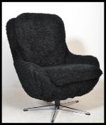 An original 1970's retro vintage swivel egg type chair on a metal five point star base being re-