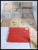 A collection of vintage cigarette cards albums including United Tobacco , South Africa , Players ,
